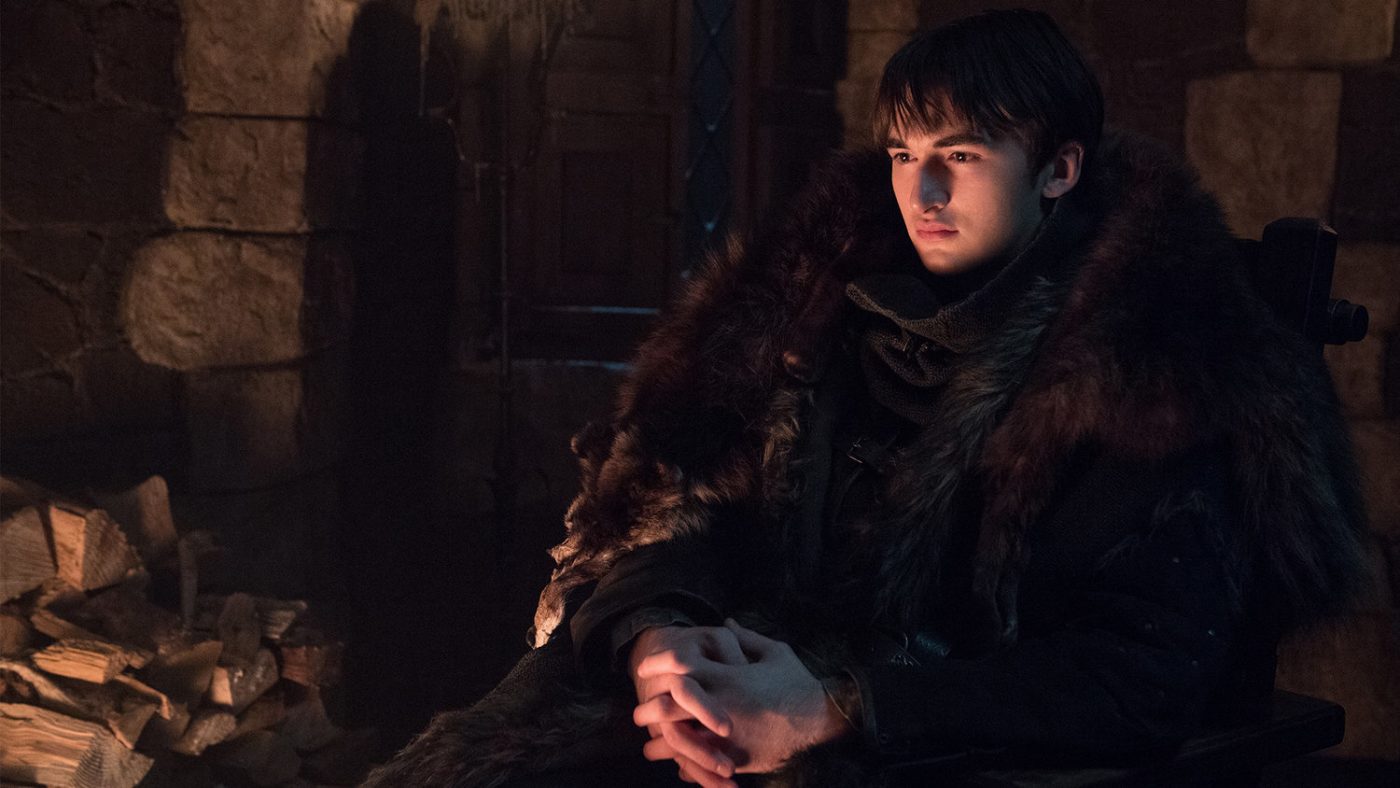 bran as the three-eyed raven watching the flames