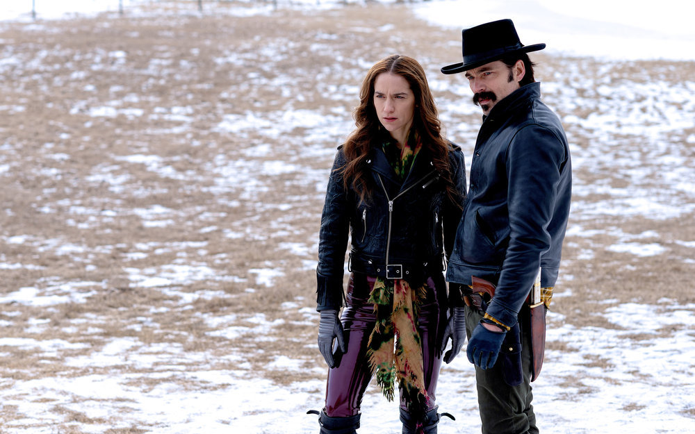 Still of Melanie Scrofano and Tim Rozon in Wynonna Earp.
