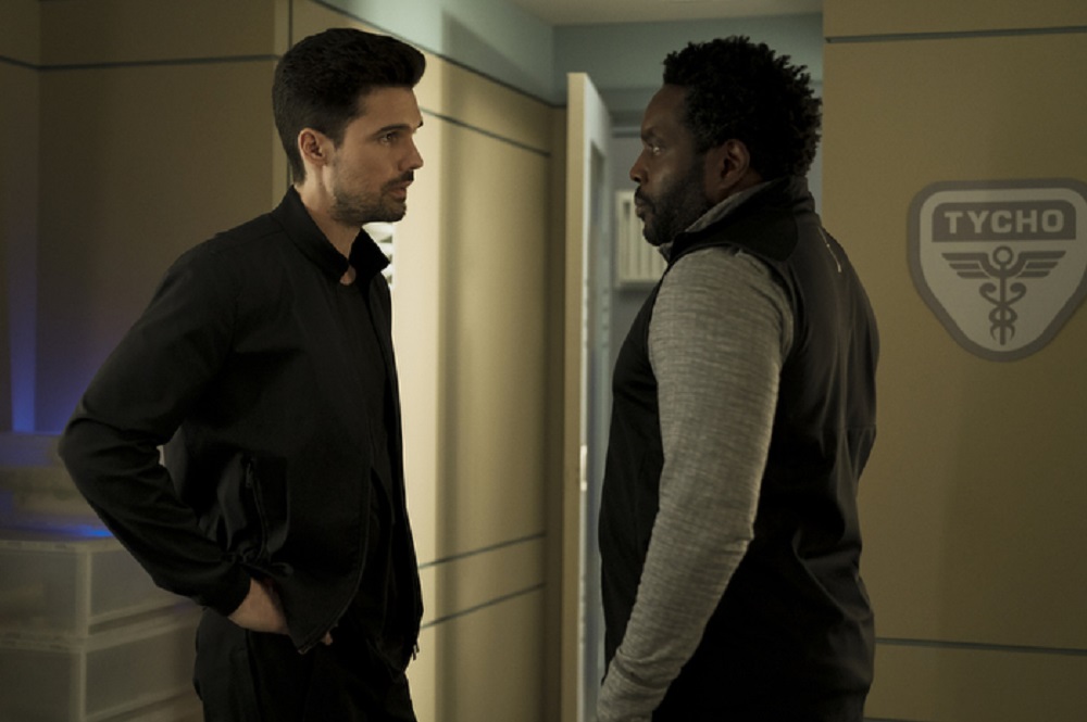 Still of Steven Strait as James Holden and Chad L. Coleman as Fred Johnson in The Expanse. Photo courtesy of Amazon Studios.