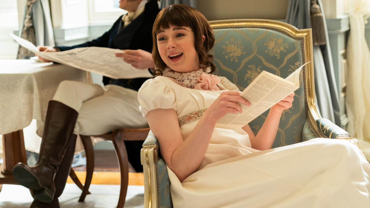 Eloise Bridgerton (Claudia Jessie) reading Lady Whistledown's scandal sheet in Bridgerton.