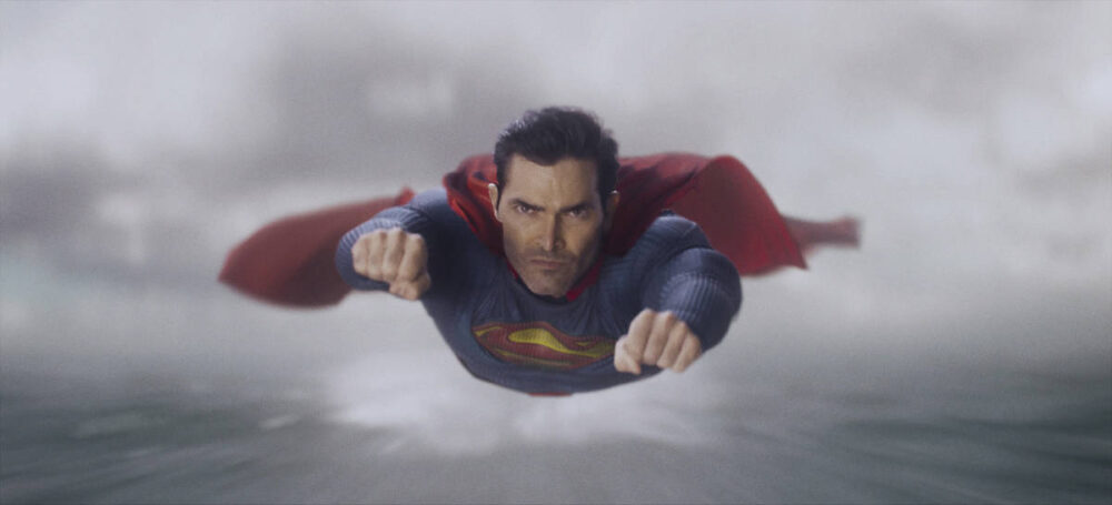 Superman flying through the sky.