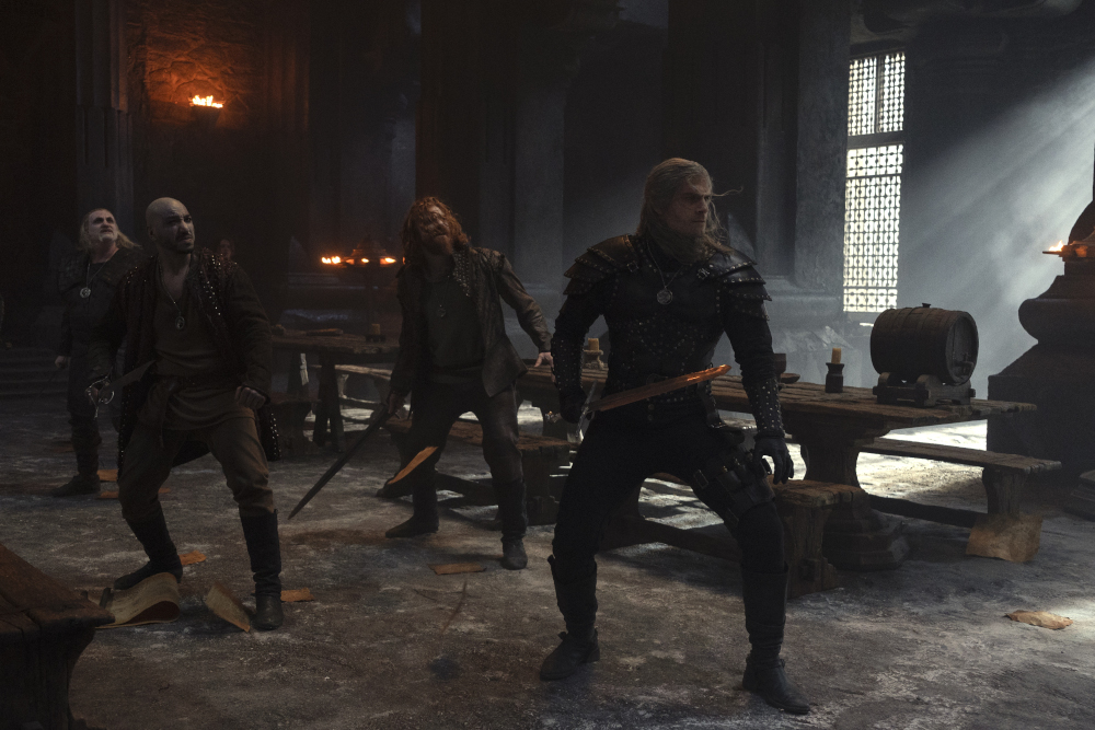 Geralt and his fellow Witchers facing off in season two of The Witcher.