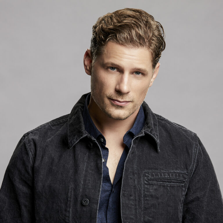 Matt Lauria headshot, man with blonde hair in black button down shirt
