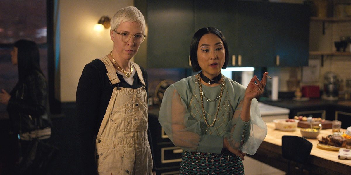 Rebecca Henderson as Lizzy and Greta Lee as Maxine, standing next to each other in the kitchen on Russian Doll Season 2 Episode 7 "Matryoshka."