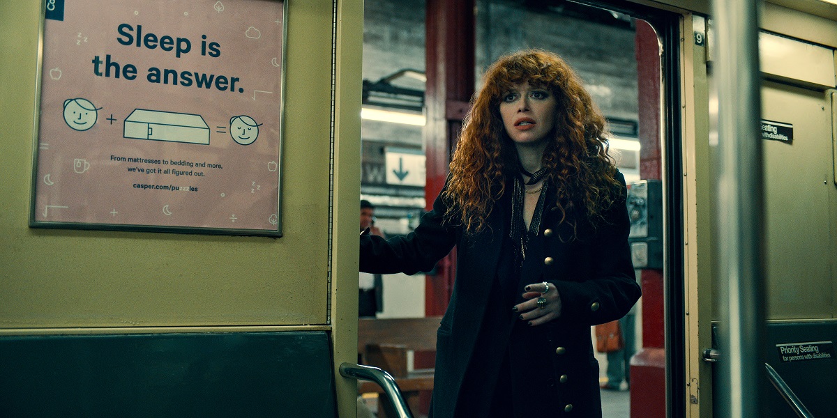 Natasha Lyonne as Nadia, standing in the doorway of a subway train while wearing all black on Russian Doll Season 2 Episode 7 "Matryoshka."