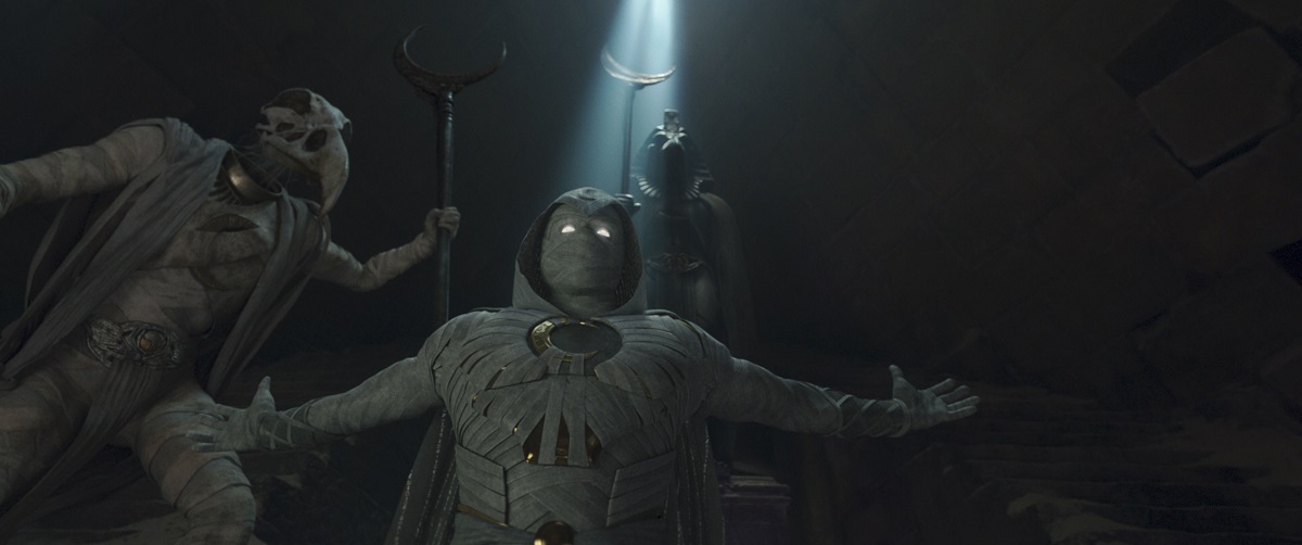 Khonshu standing above Moon Knight in a dark temple in Moon Knight Season 1 Episode 6, "Gods and Monsters."