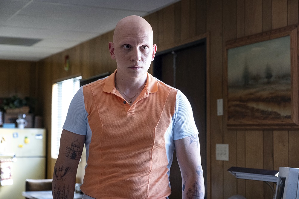 NoHo Hank wearing an orange and white shirt while standing in a trailer on Barry Season 3 Episode 1, "forgiving jeff."
