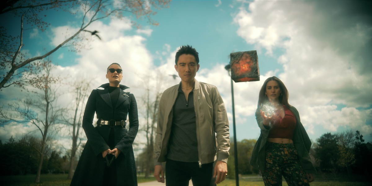 Fei, Ben and Sloane standing side-by-side in the sunlight on an empty street in The Umbrella Academy Season 3.
