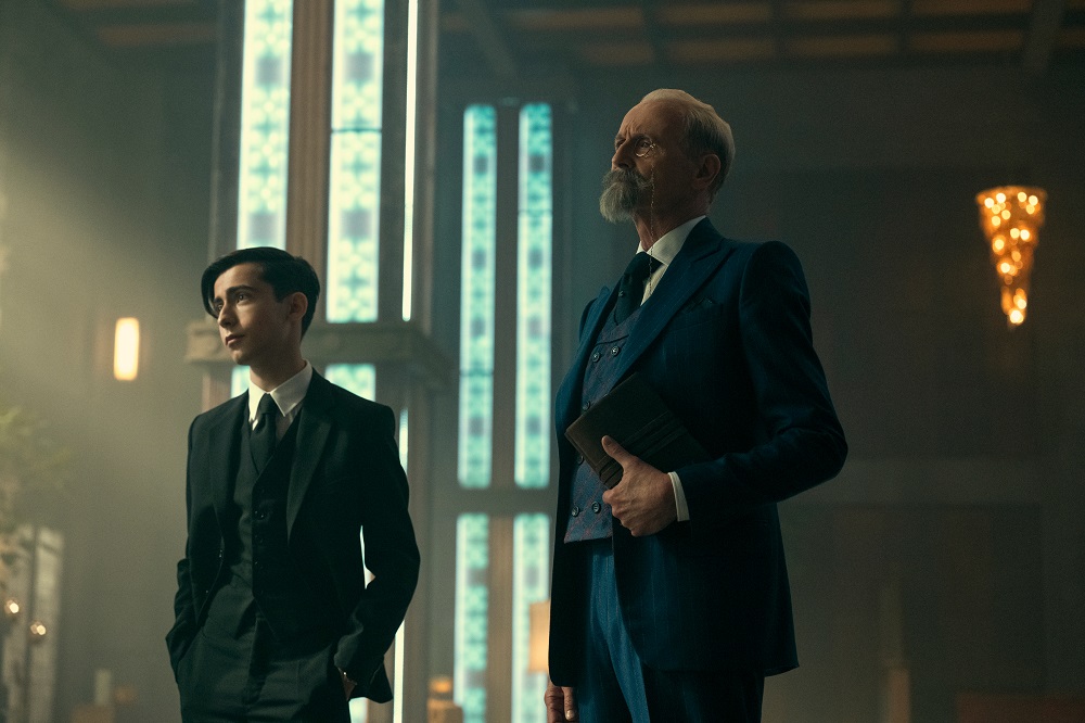 Five and Reginald stand in the lobby of the Hotel Obsidian on The Umbrella Academy Season 3 Episode 10 "Oblivion."
