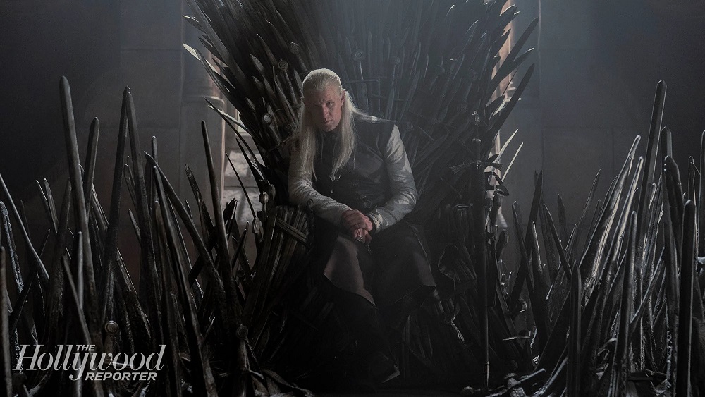 Matt Smith as Prince Daemon Targaryen, sitting on the Iron Throne while looking imposing on House of the Dragon.