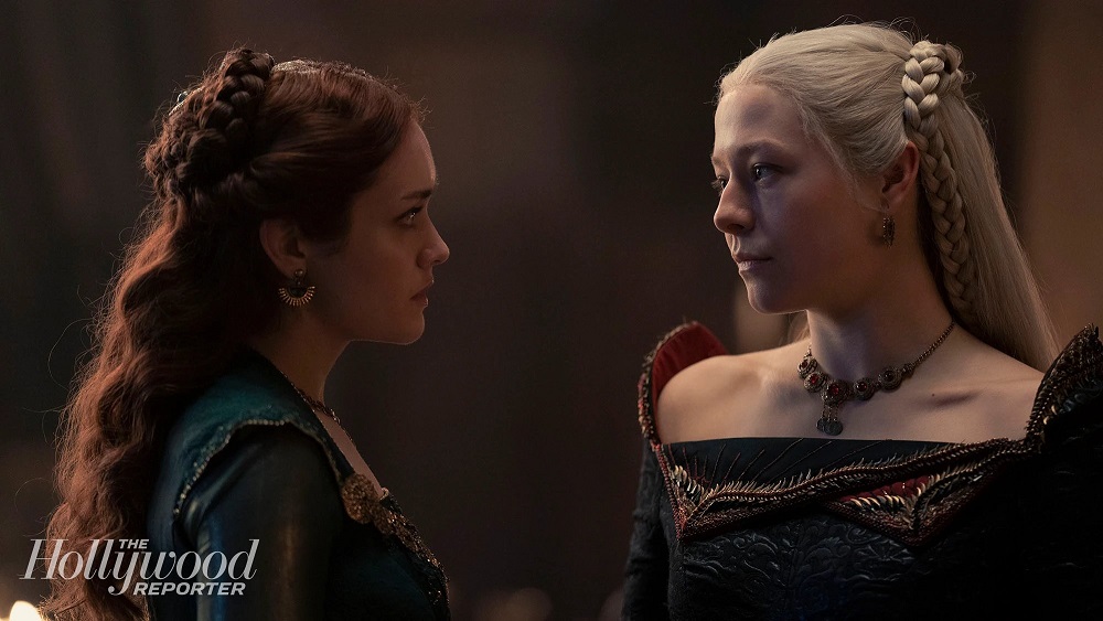 Olivia Cooke as Alicent Hightower and Emma D'Arcy as Princess Rhaenyra Targaryen, facing each other while having a conversation on HBO's House of the Dragon.
