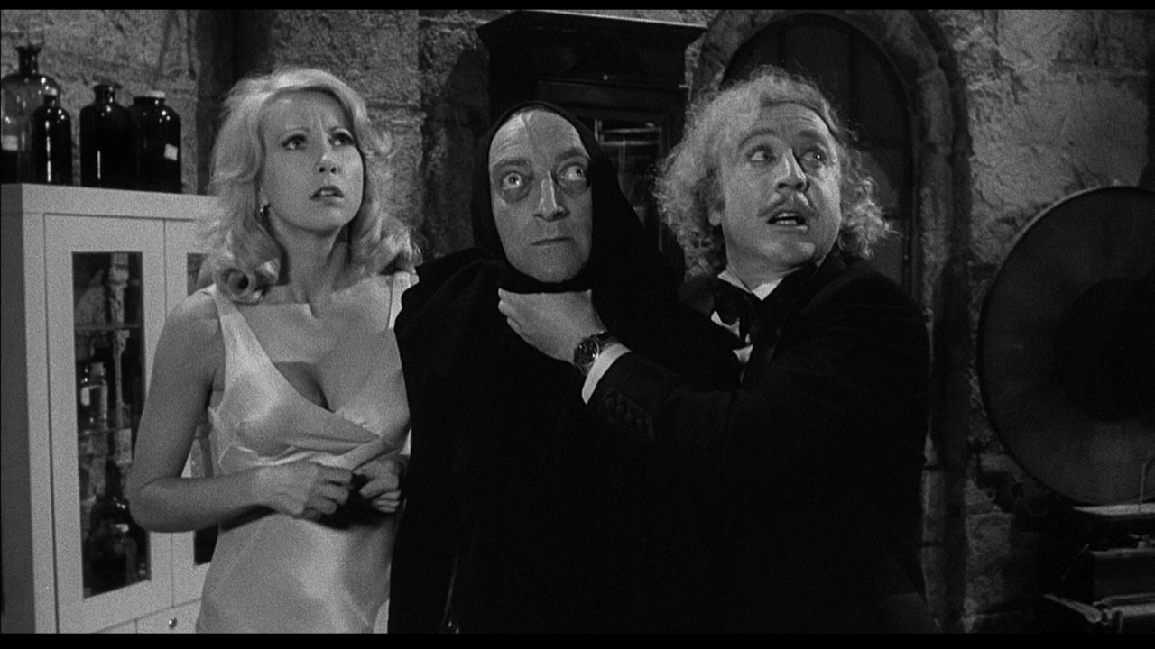 Gene Wilder, Marty Feldman and Teri Garr are stunned by a noise in Mel Brooks' Young Frankenstein.