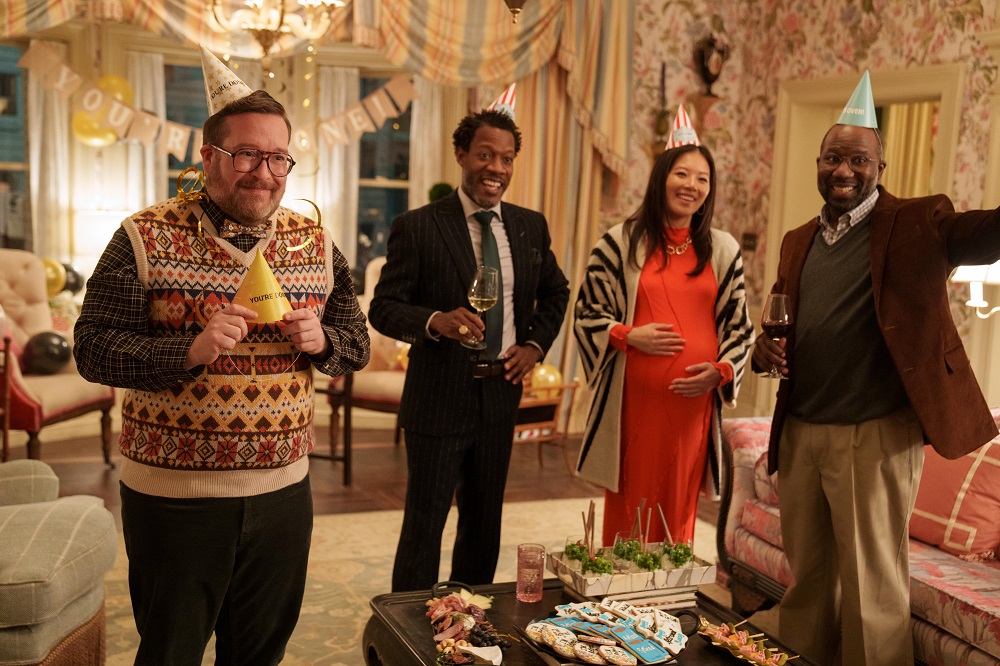 Howard, Liam, Nina and Dr. Grover stand in Bunny's living room while surrounded by party decorations in Only Murders in the Building Season 2 Episode 3 "The Last Day of Bunny Folger."