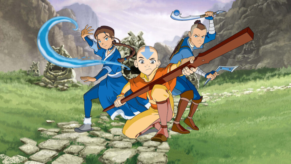 Katara, Aang and Sokka posing with the weapons out in the Avatar: The Last Airbender tv show.