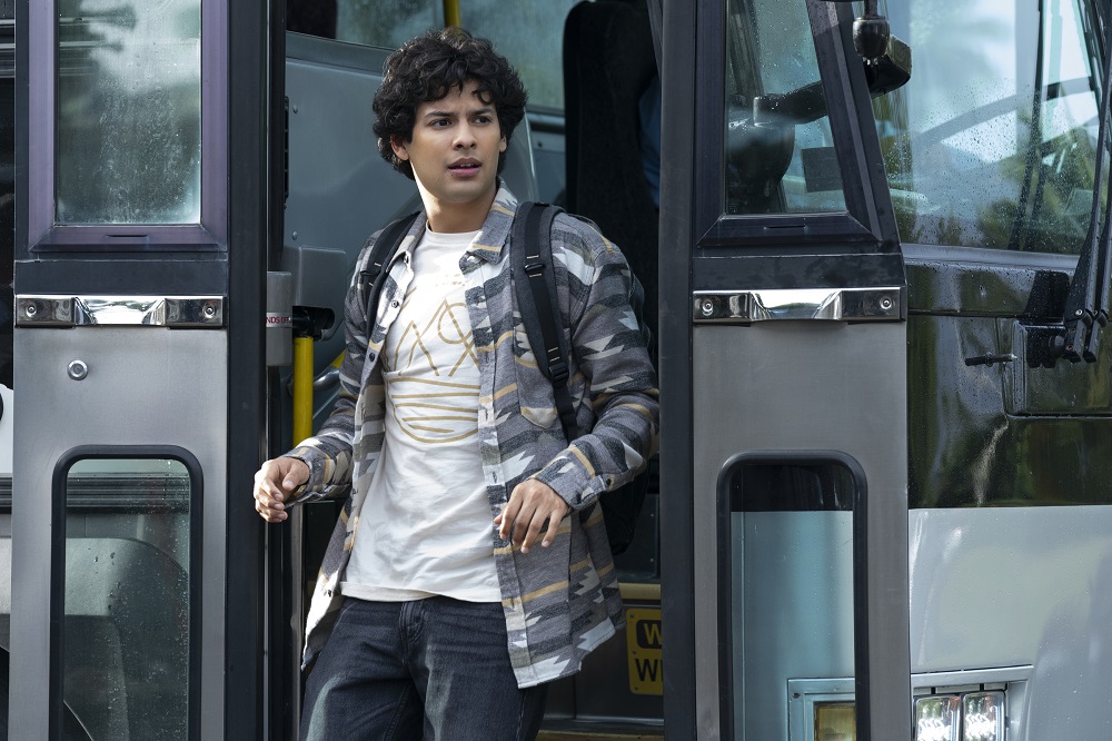 Miguel Diaz exits a bus on Netflix's Cobra Kai Season 5.