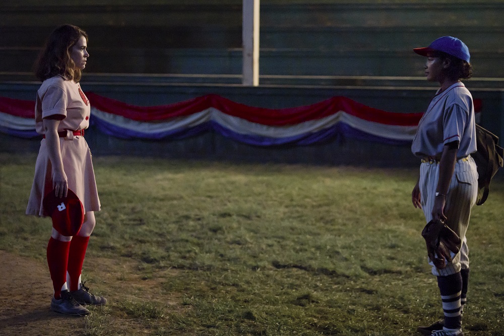 Carson and Max stand and face each other on a field at night on A League of Their Own Season 1 Episode 4 "Switch Hitter."