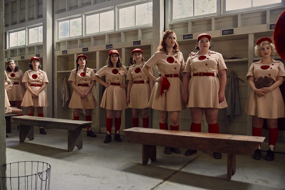 The Rockford Peaches stand in the locker room before a game on A League of Their Own Season 1 Episode 4 "Switch Hitter."