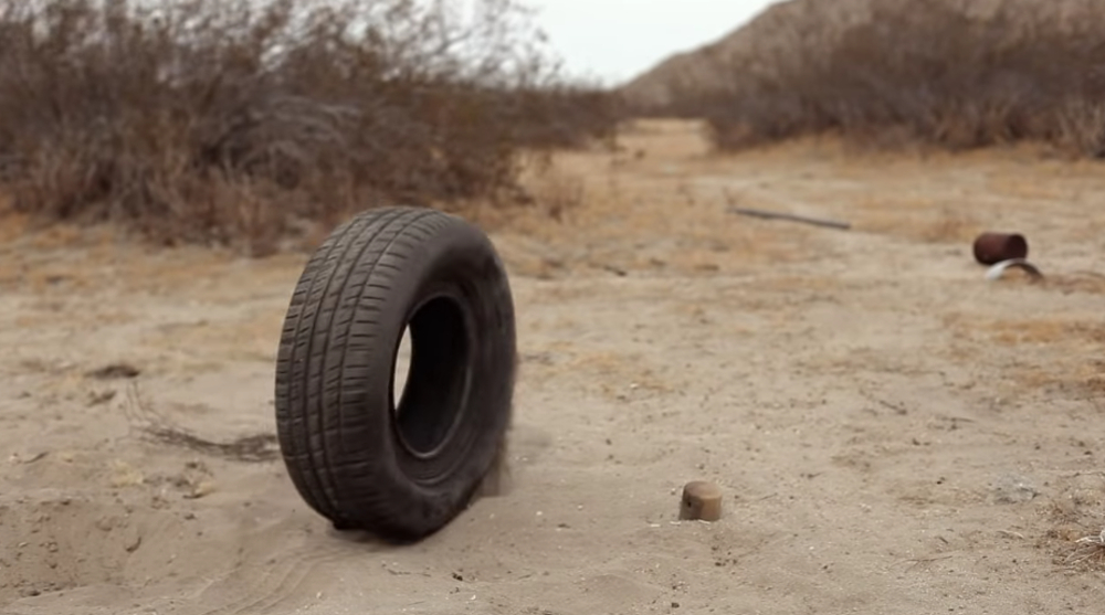 Robert the tire rolling through a dirt path