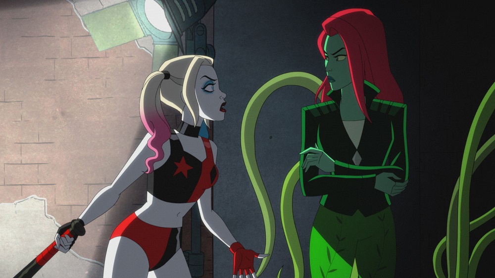 Harley chats with a cross-looking Ivy in a dimly lit alleyway on Harley Quinn Season 3 Episode 8, "Batman Begins Forever."