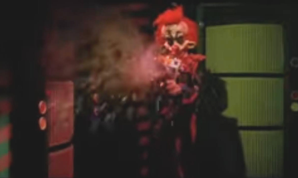 A killer Klowns shoots toward the camera
