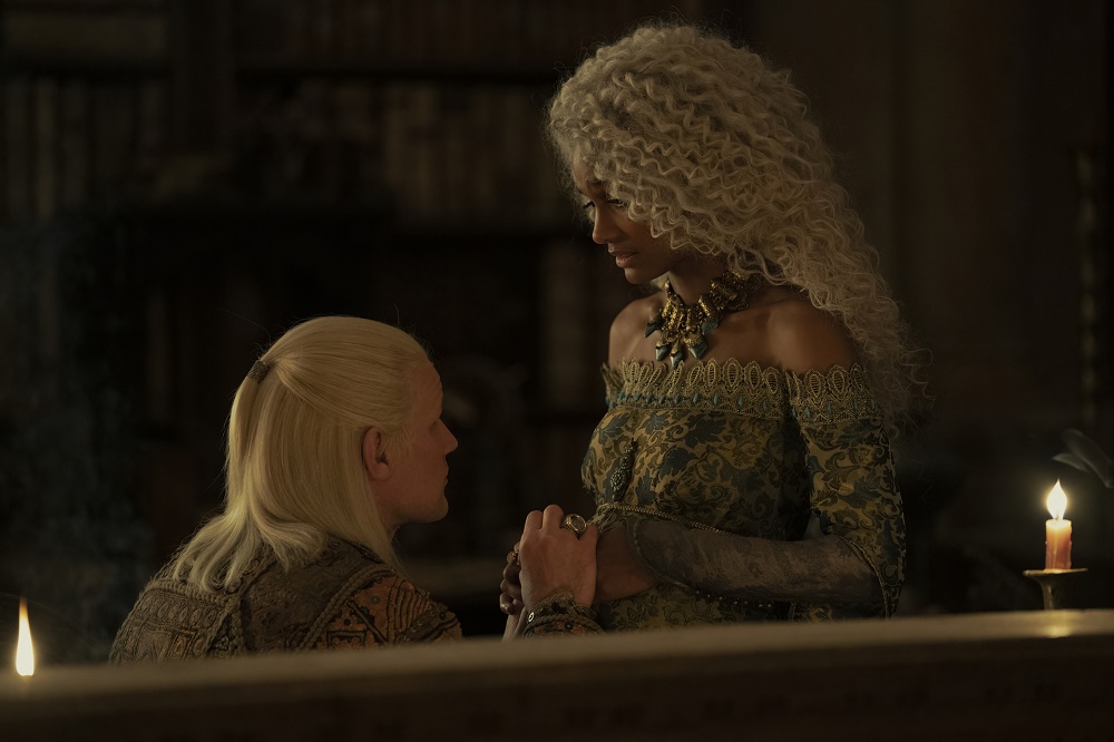Daemon Targaryen lays his hands over his wife Laena Velaryon's pregnant stomach in House of the Dragon Season 1 Episode 6, "The Princess and the Queen."