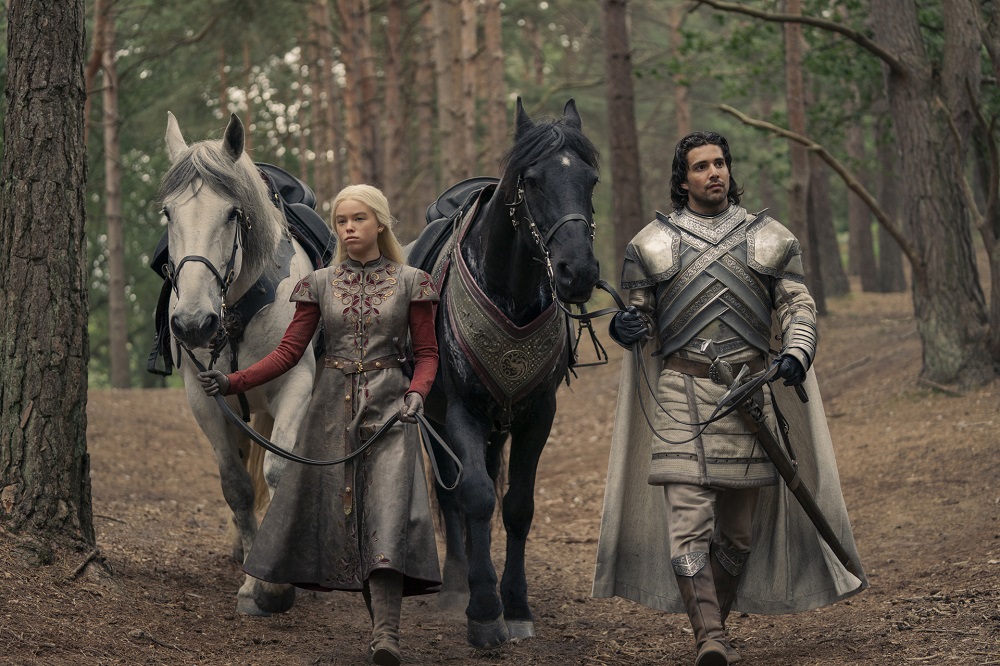 Rhaenyra and Criston Cole walk through a forest with their horses on House of the Dragon Season 1 Episode 3, "Second of His Name."