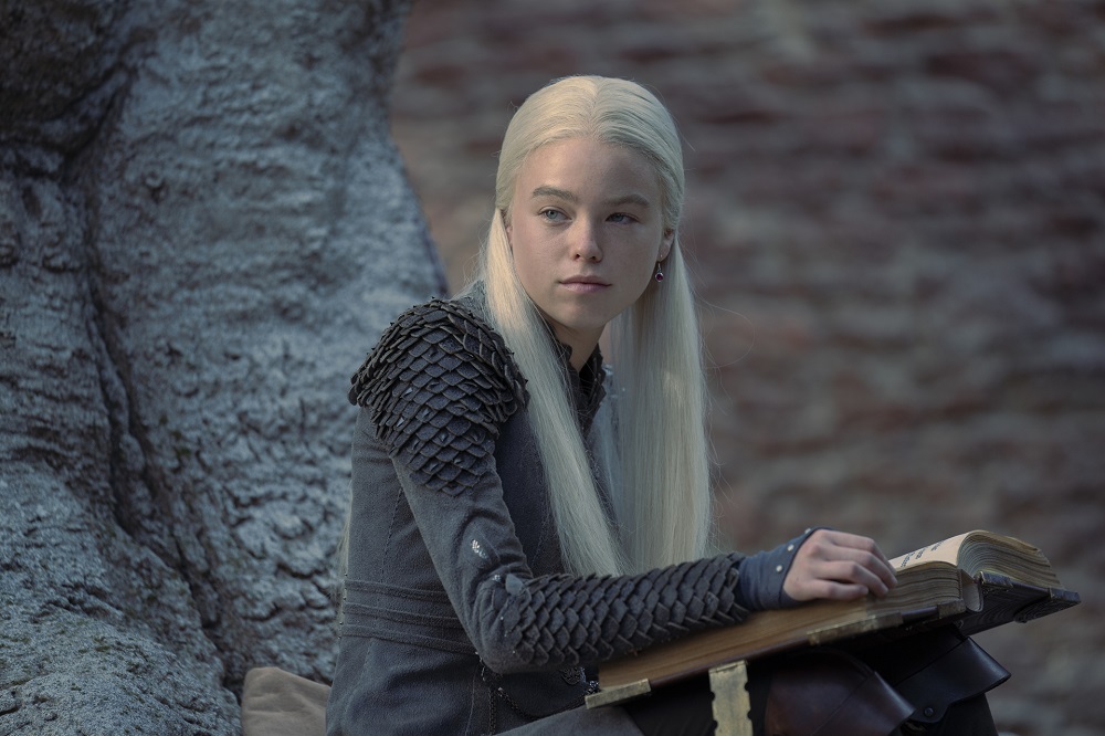 Princess Rhaenyra sits on a tree while looking pensive in House of the Dragon Season 1 Episode 3, "Second of His Name."