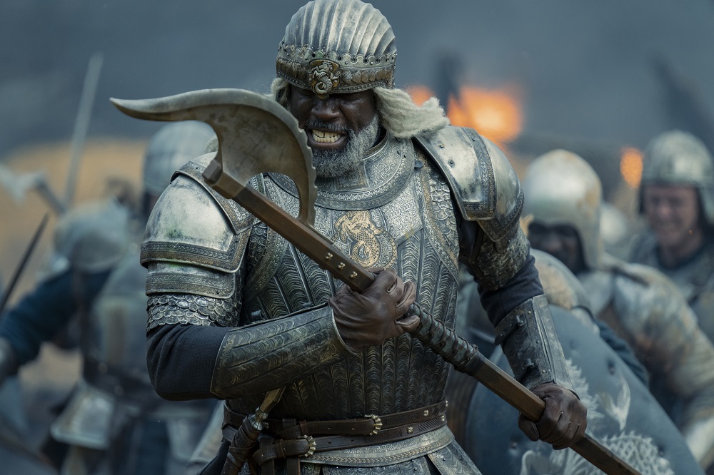 Lord Corlys Velaryon charges into battle while wearing armor and holding an ax on House of the Dragon Season 1 Episode 3, "Second of His Name."
