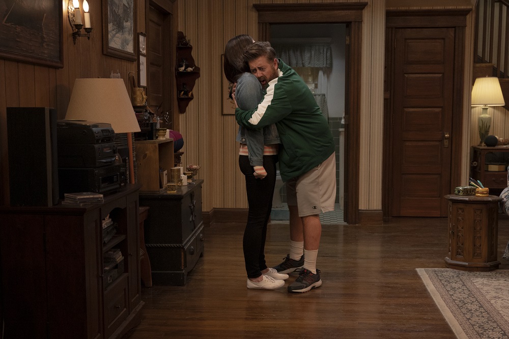 Kevin embraces Allison tightly in their living room in Kevin Can F**k Himself Season 2 Episode 8, "Allison's House."
