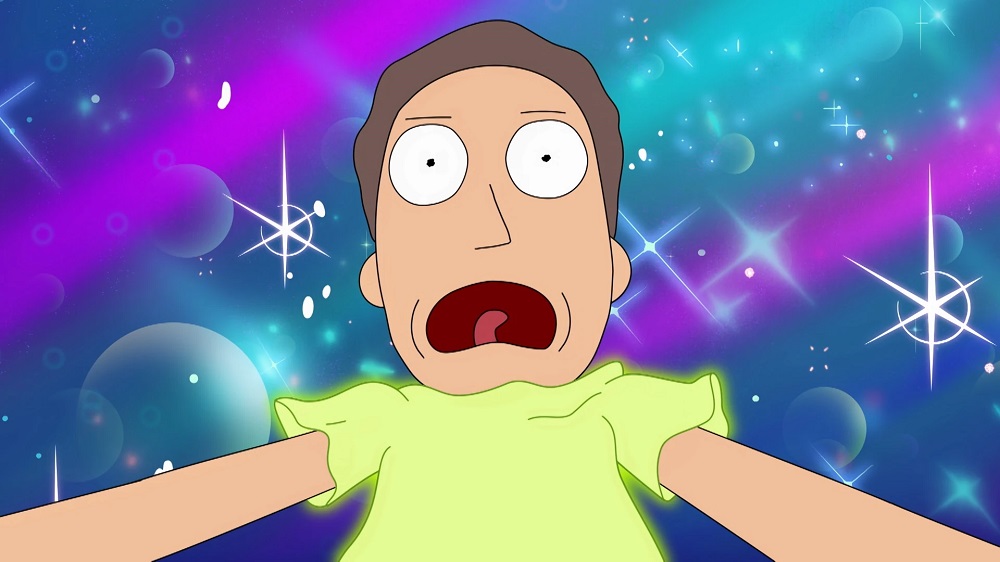 Jerry looks shocked while his yellow shirt glows and a blue, purple, and teal background sparkles behind him in Rick and Morty Season 6 Episode 5, "Final Desmithation."