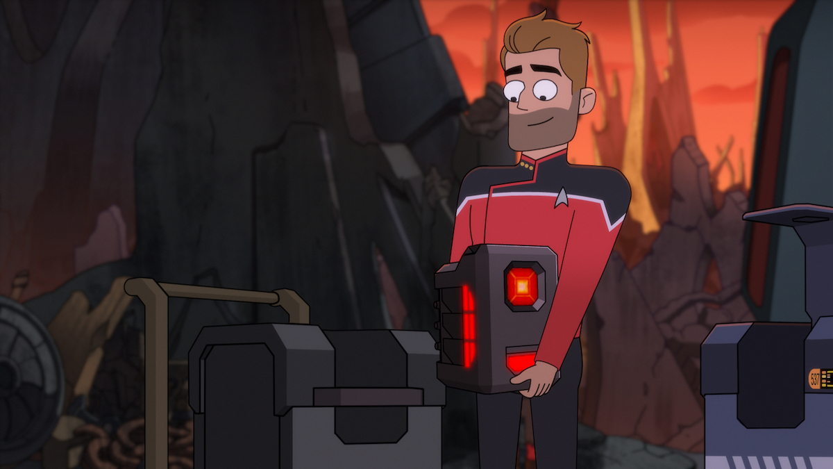 Ransom carries Agimus to a containment transportation device. In the background a black rocky surface and a reddish glowing light is visible.
