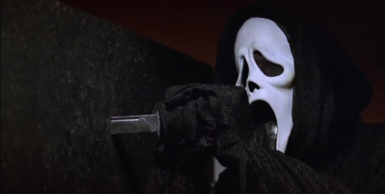 Ghost face stabs a knife through a wall in Scream 2