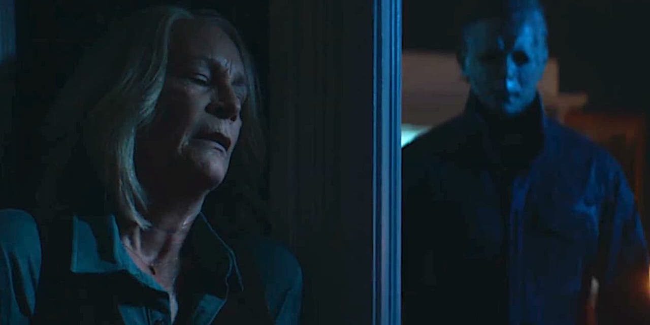 Laurie Strode (Jamie Lee Curtis) hiding from Michael Myers (James Jude Courtney) in Halloween Ends