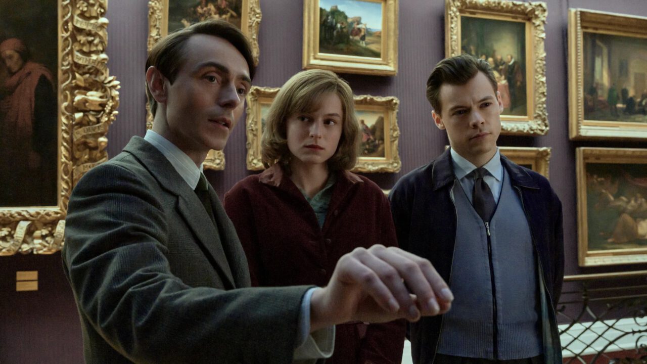 David Dawson, Emma Corrin and Harry Styles look at paintings in My Policeman