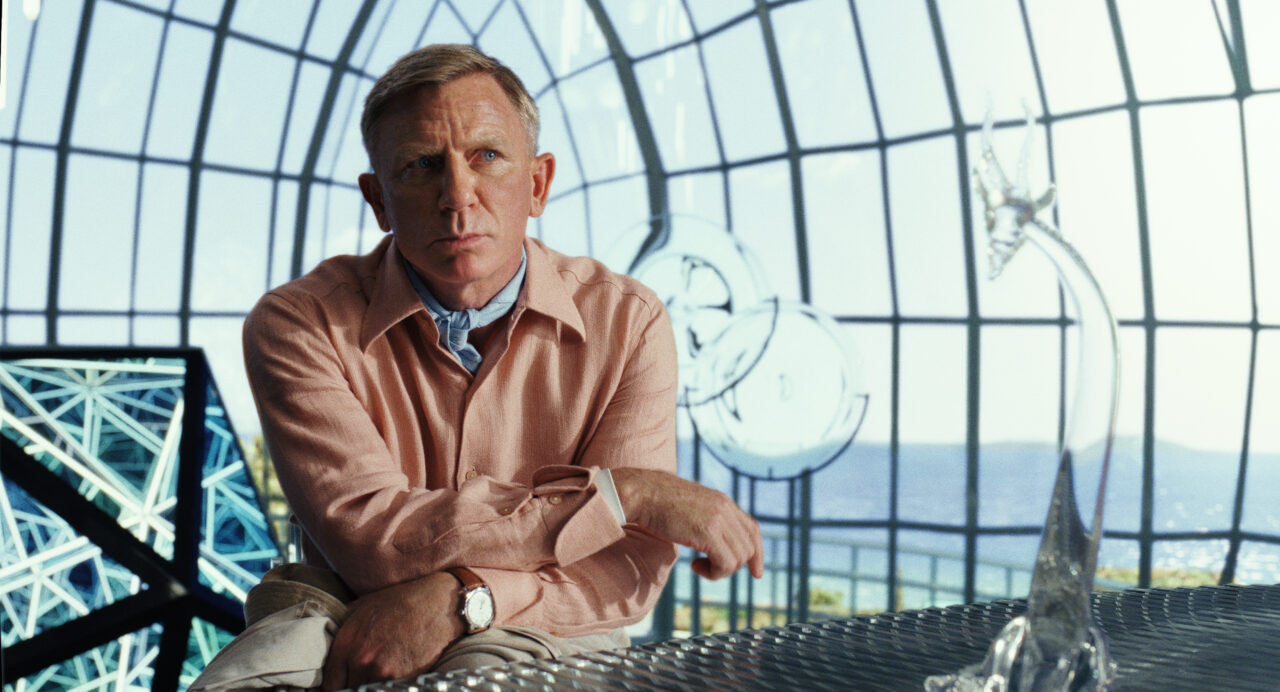 Daniel Craig looks quizzically at the camera in Glass Onion: A Knives Out Mystery.