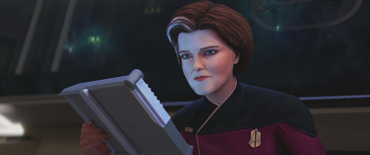  Kate Mulgrew as Janeway, looking at her PADD aboard the Dauntless.
