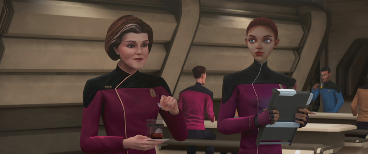 Kate Mulgrew as Vice Admiral Janeway and Jameela Jamil as Ensign Ascencia. Janeway is drinking black tea. Ascencia is carrying a PADD.