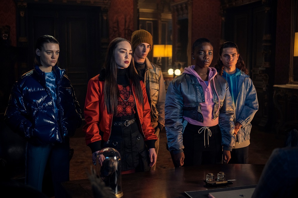 Yoko Tanaka, Divina, Ajax Petropolus, Bianca Barclay and Kent stand in the principal's office at Nevermore Academy on Wednesday Season 1 Episode 8, "A Murder of Woes."