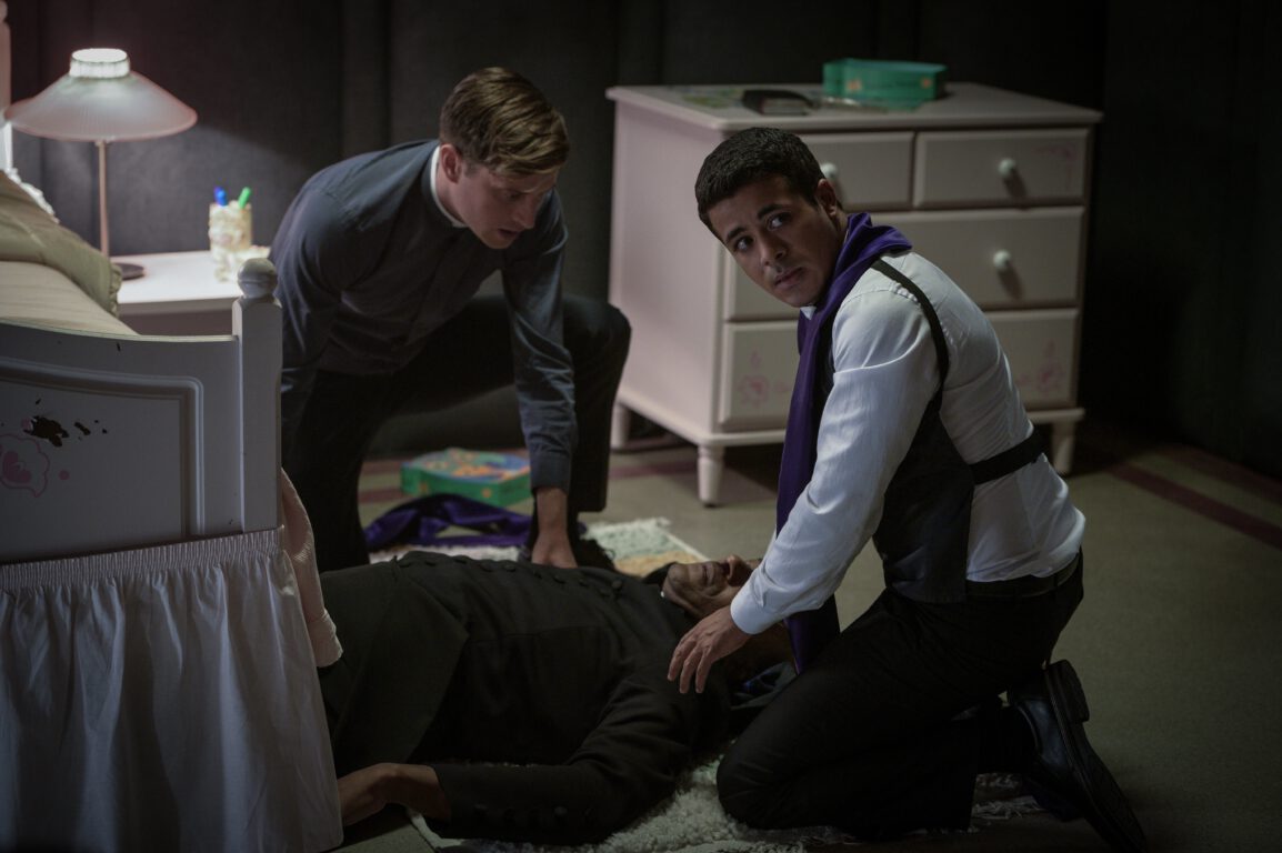 Father Raymond (Nicholas Ralph) and Father Dante (Christian Navarro) perform and exorcism in Prey for the Devil