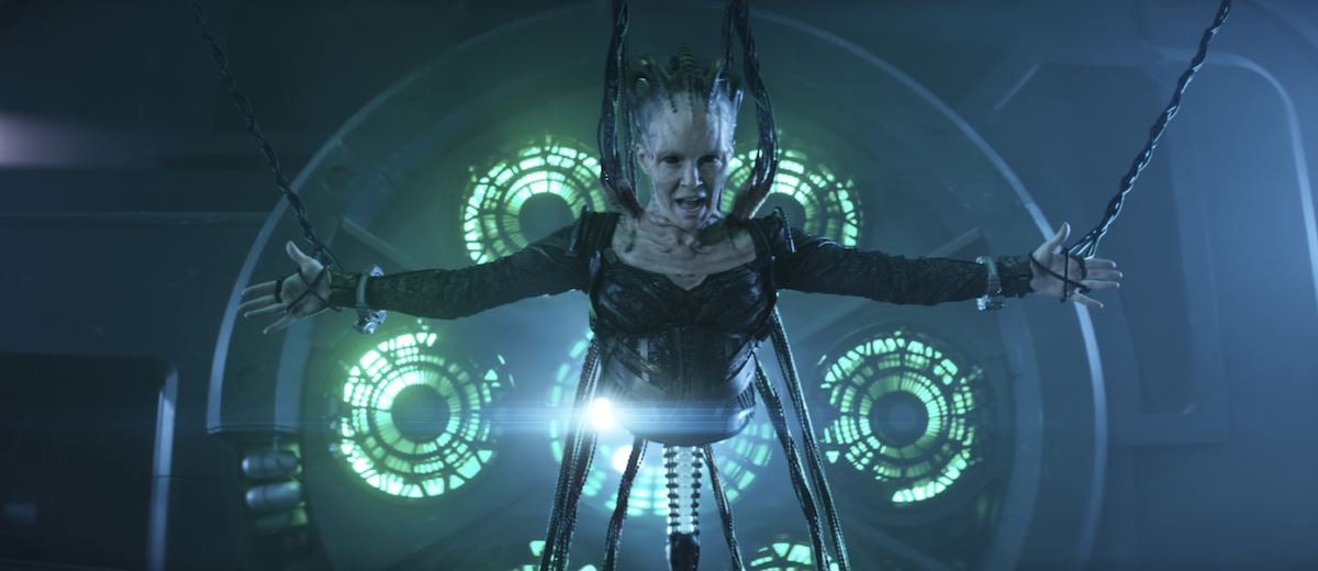 Annie Wersching as the Borg Queen in front of the La Sirena's warp core in Star Trek: Picard season 2.