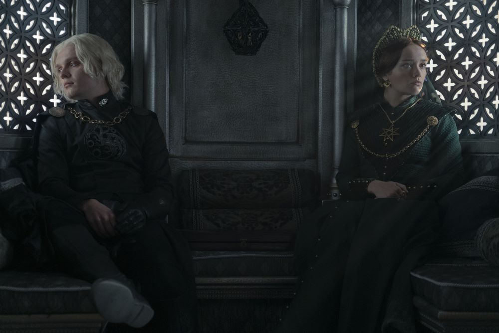 Aegon Targaryen and Alicent Hightower sit across from each other in their carriage while looking out opposite windows in House of the Dragon Season 1 Episode 9, "The Green Council."