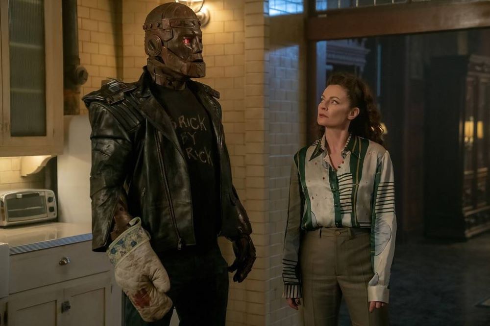 Cliff and Laura stand next to each other in the Doom Manor kitchen in Doom Patrol Season 4 Episode 2, "Butt Patrol."