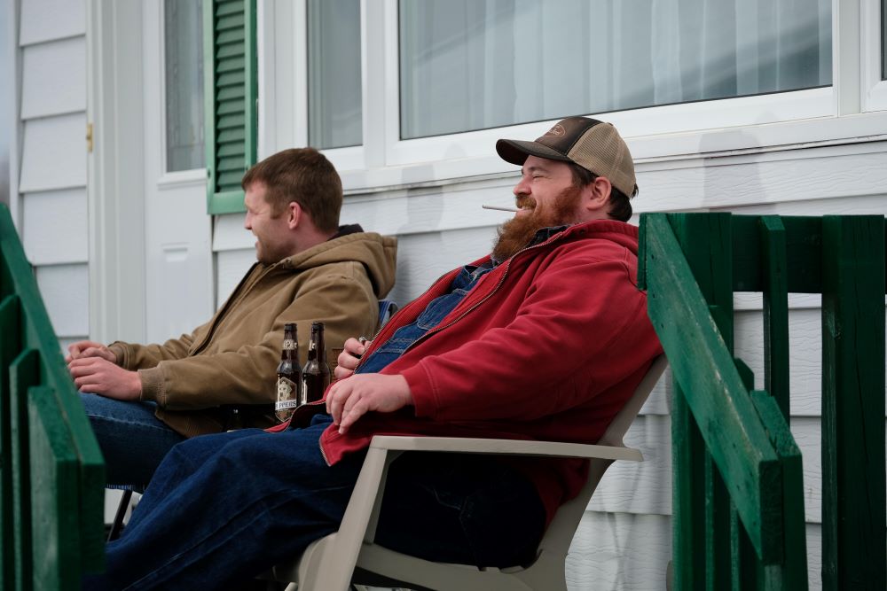 Wayne and Squirrely Dan sit in deck chairs while outside in the cold in Letterkenny Season 11 Episode 2, "Okoya."