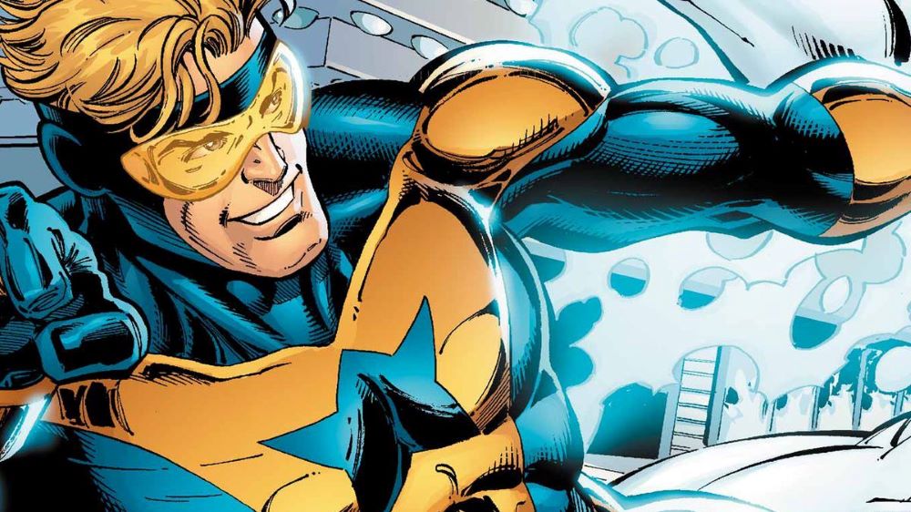 DC comic book character Booster Gold, wearing a gold and black suit, who will star in a DC Studios project.