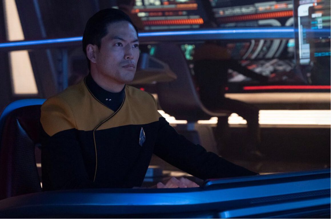 Joseph Lee as Mura on the bridge of the Titan-A.