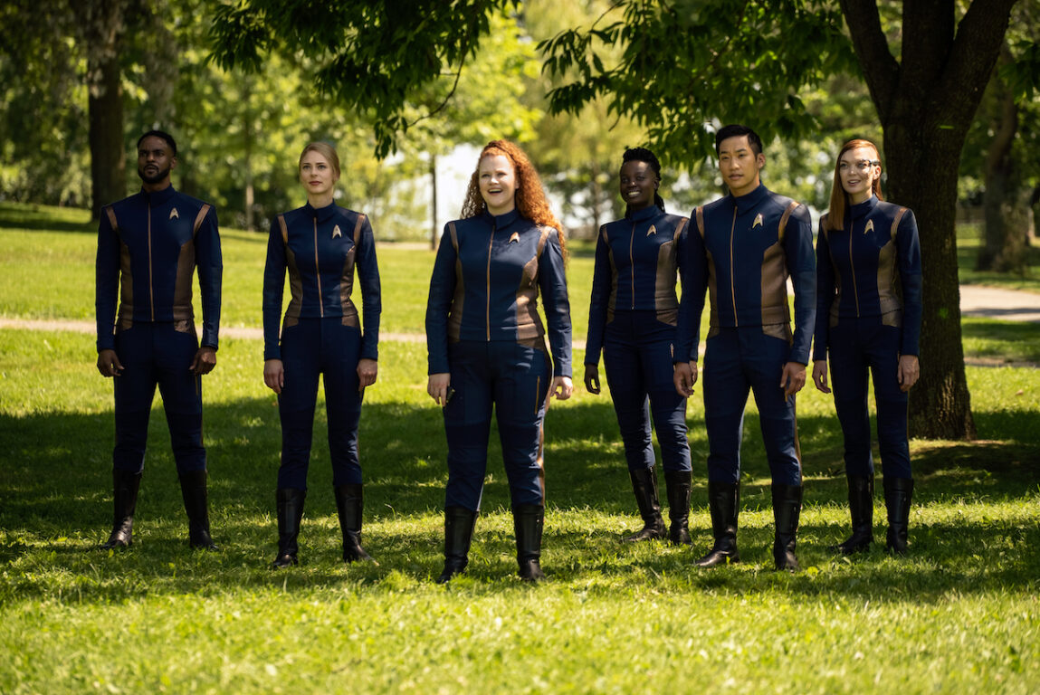 Pictured (L-R): Ronnie Rowe Jr. as Lt. Price; Sara Mitich as Lt. Nilsson; Mary Wiseman as Tilly; Oyin Oladejo as Operations officer Joann Owosekun; Patrick Kyok Choon as Lt. Gen Rhys and Emily Coutts as Keyla Detmer of the CBS All Access series STAR TREK: DISCOVERY. The crew is standing in a grassy field in San Francisco on Earth.