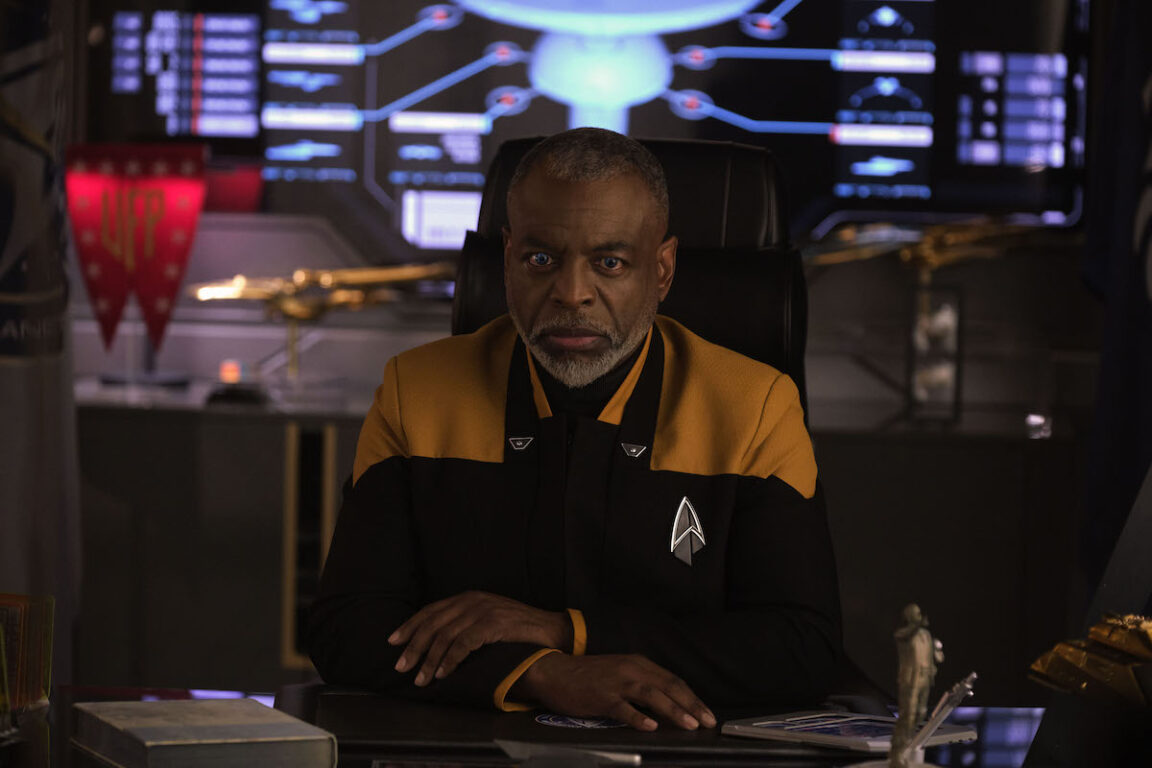 LeVar Burton as Geordi La Forge at his desk in"The Bounty" Episode 306, Star Trek: Picard on Paramount+. On the desk is the model of the Cochrane statue.