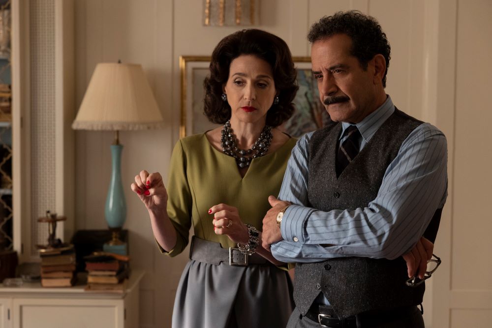 Rose and Abe stand in their living room while looking focused in The Marvelous Mrs. Maisel Season 5 Episode 9, "Four Minutes."