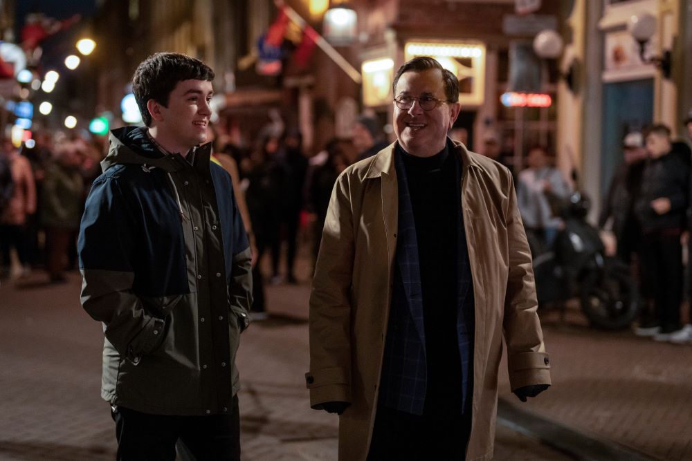 Will and Higgins walk through the streets of Amsterdam at night in Ted Lasso Season 3 Episode 6, "Sunflowers."