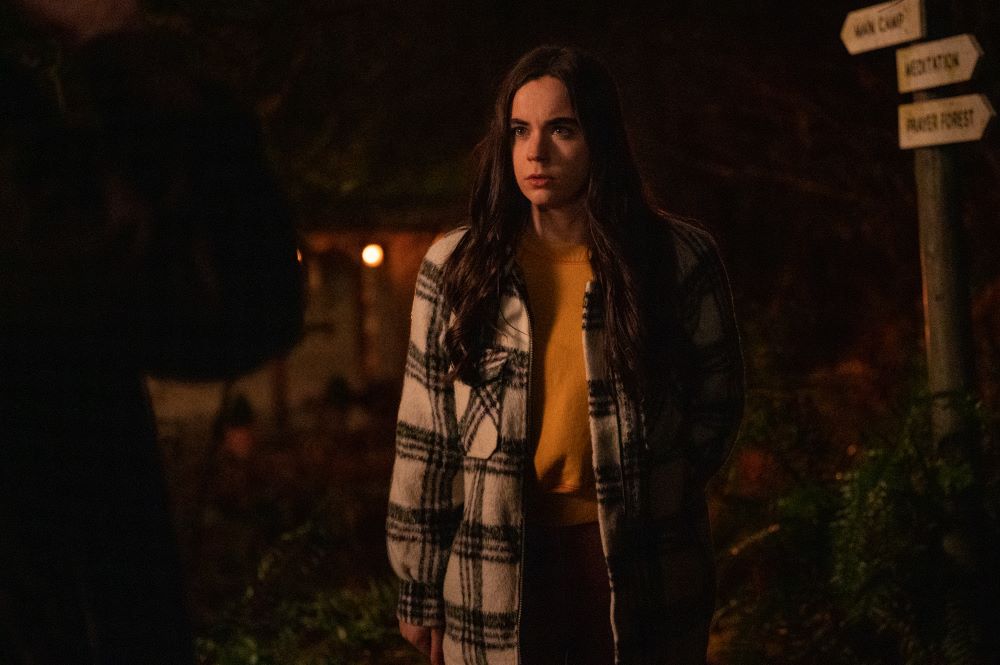 Callie stands outside of Lottie's compound at night in Yellowjackets Season 2 Episode 9, "Storytelling."